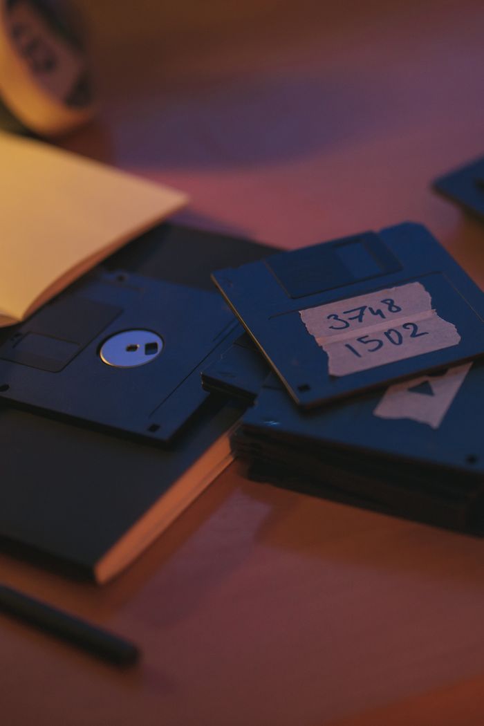 Retro floppy disks on a desk evoke nostalgia and early digital storage history.